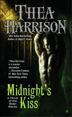 cover for Midnight's Kiss by Thea Harrison. A shirtless blond white man is chained up in a dungeon, arms strained above his head.